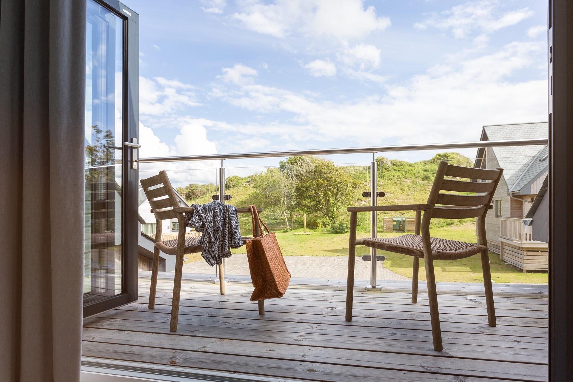 As well as the large decking downstairs, there is a balcony upstairs to sit and soak up the sun in.