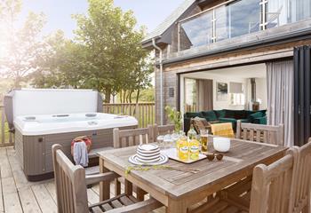 If you can pull yourself out of the hot tub, then enjoy dinner alfresco on your decking.