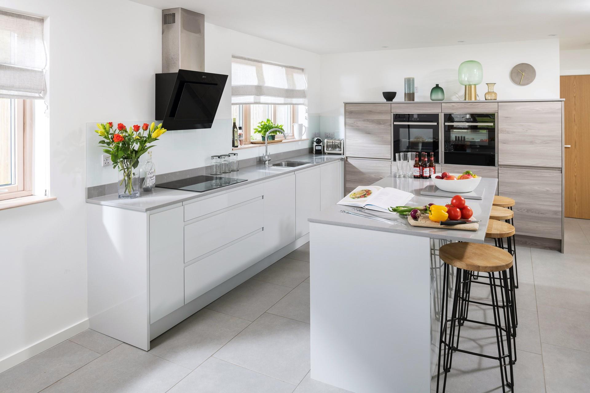 The kitchen is well-equipped and finished with a breakfast bar - a wonderful way to enjoy cooking a delicious family meal. 