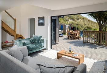 Bi-fold doors open up from the open plan living area onto the property's private decking area letting the Cornish sun pour in. 