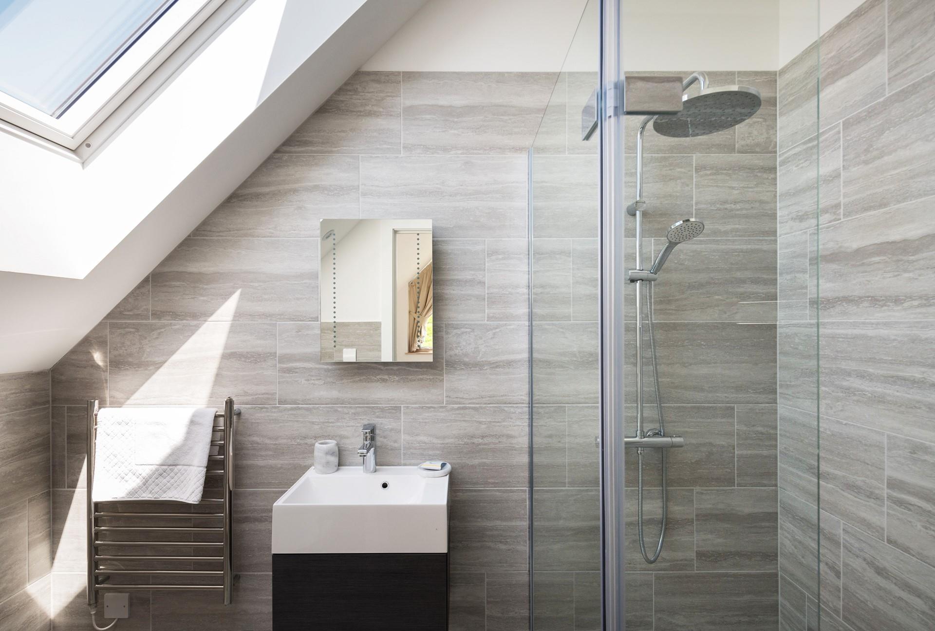 Bedroom 3 is complete with a walk-in rainfall shower, just what you need after spending a day exploring the dunes.