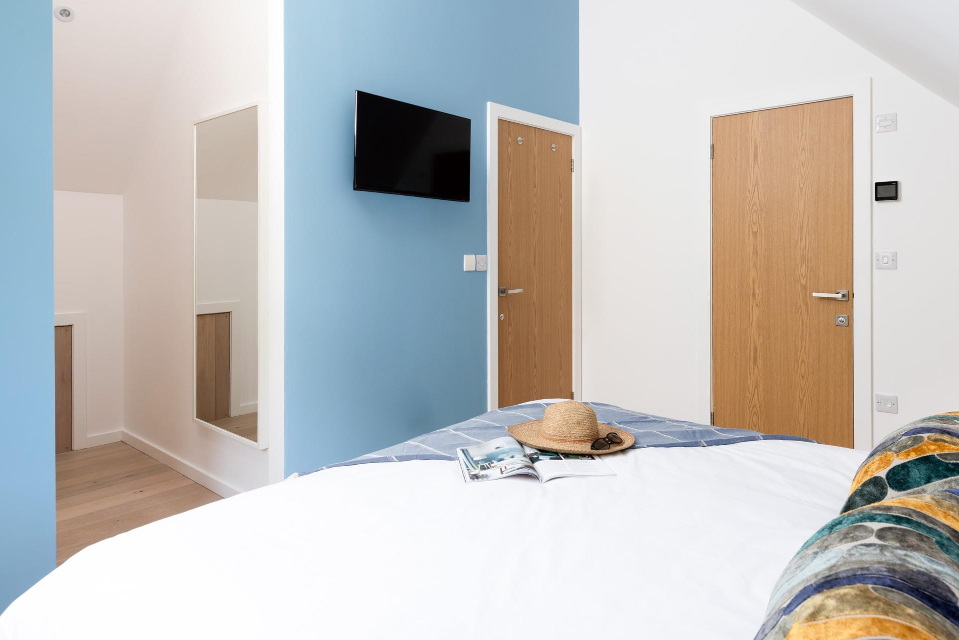 Cosy up and relax in bed after a day of adventures. 
