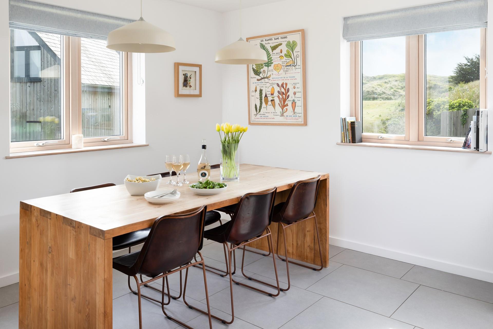 Gather together around the dining table, tucking into a delicious family meal.