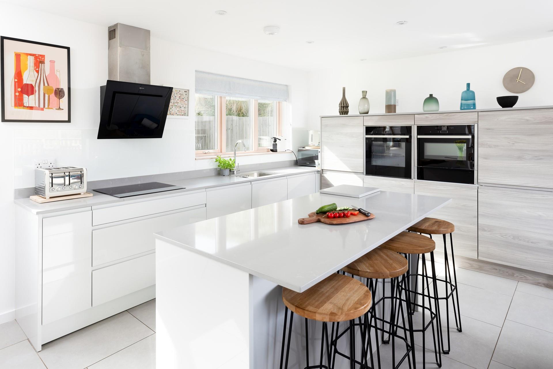 The kitchen is well-equipped and finished with a breakfast bar - a wonderful way to enjoy cooking a family meal. 