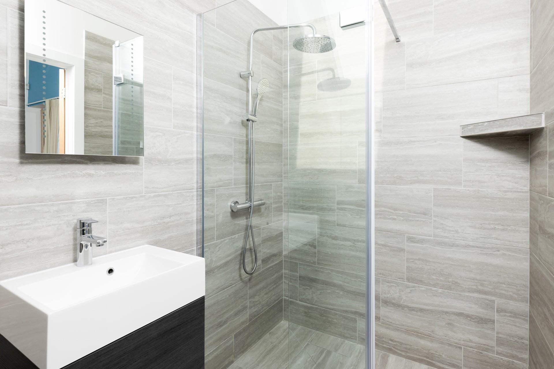 Bedroom 3 has an ensuite with a rainfall shower, perfect for washing off sandy feet after a day at the beach.