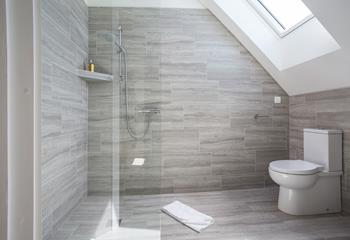 Wander into the en suite and start your day right with a hot shower.
