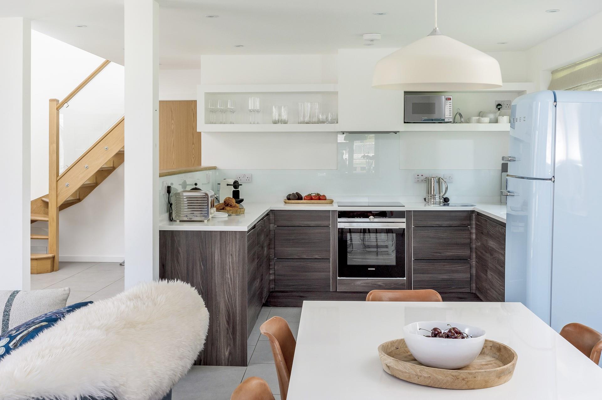 The well-equipped kitchen is modern and sleek for you to cook up a feast.