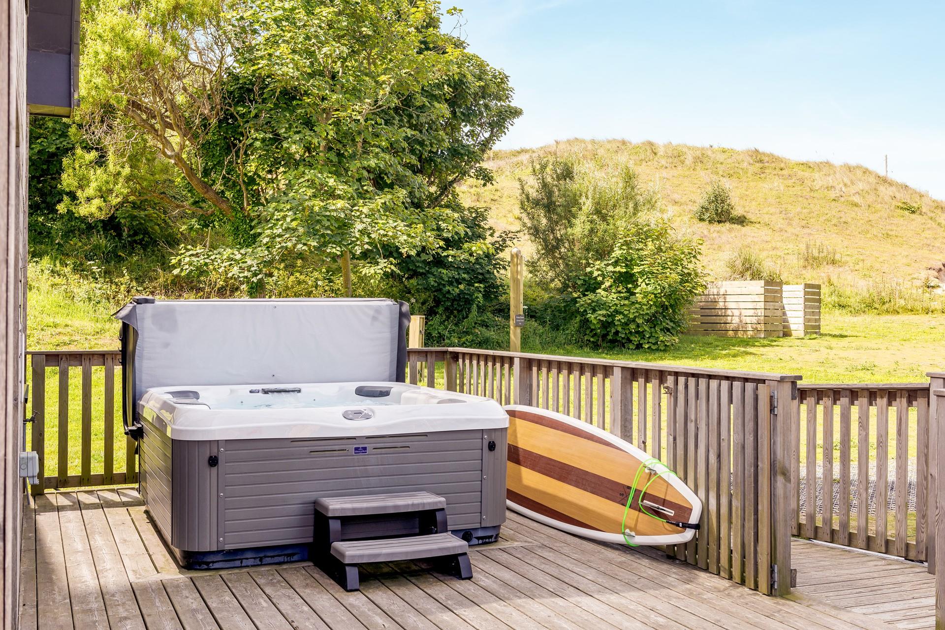 Take a dip in the bubbling hot tub with a glass of prosecco in hand.