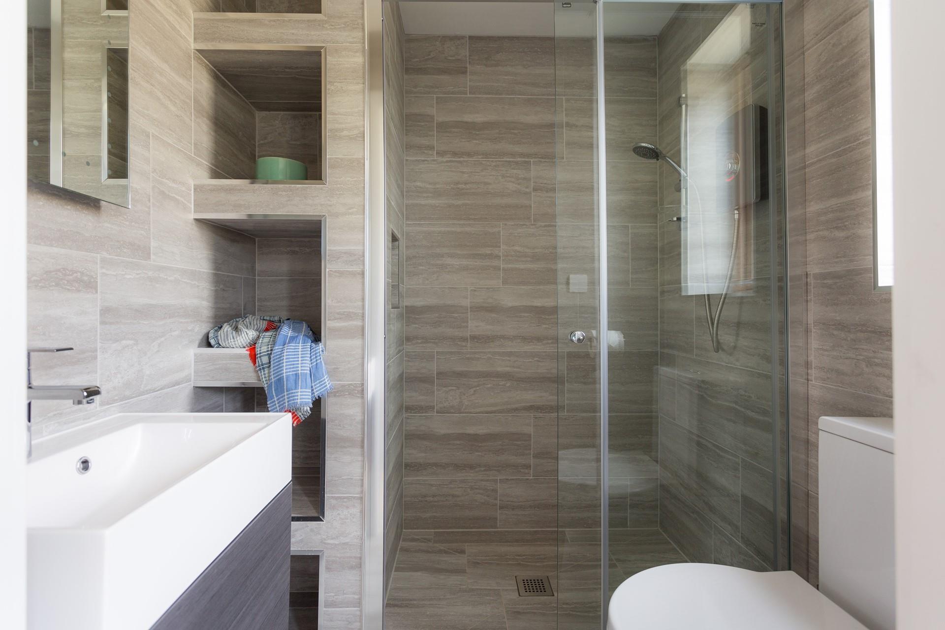 Wash off sandy toes in the en suite after a day on the beach.