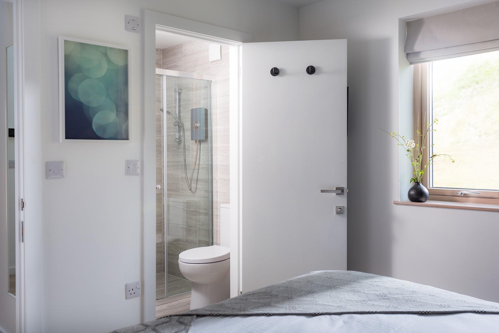 Wake up and get ready for the day in the sleek en suite.