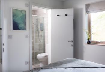Wake up and get ready for the day in the sleek en suite.