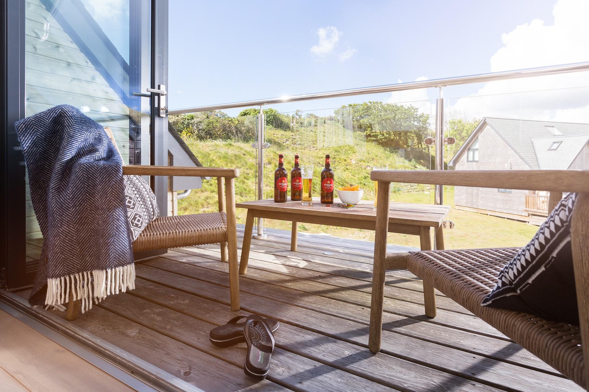 Enjoy a beer or two out on the balcony soaking up the evening sun.