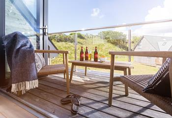 Enjoy a beer or two out on the balcony soaking up the evening sun.
