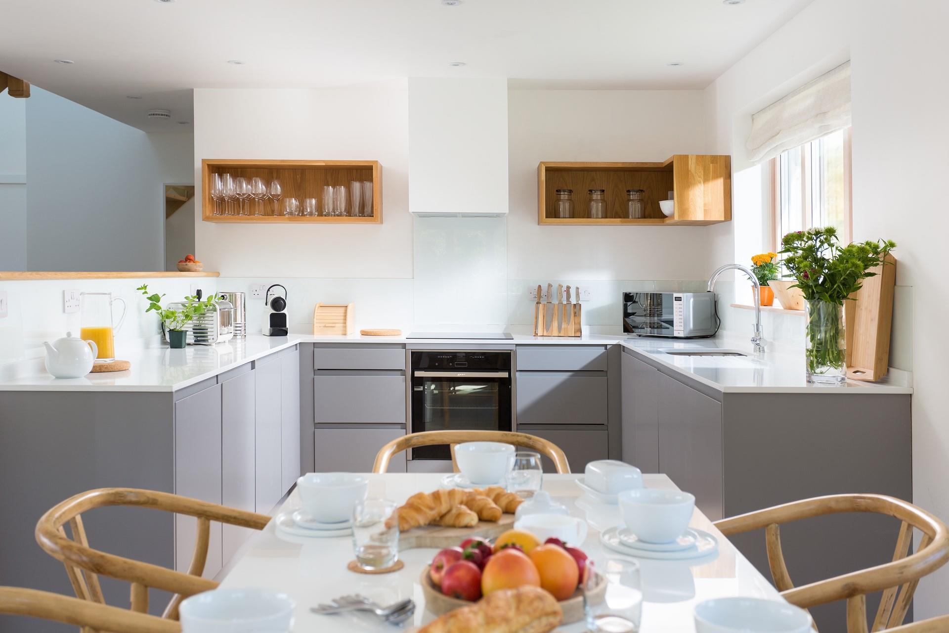 The beautiful modern kitchen is well-equipped for you to feel at home during your stay. 