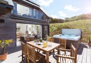 Open up the bi-fold doors onto the deck for alfresco dining and dipping in the hot tub.