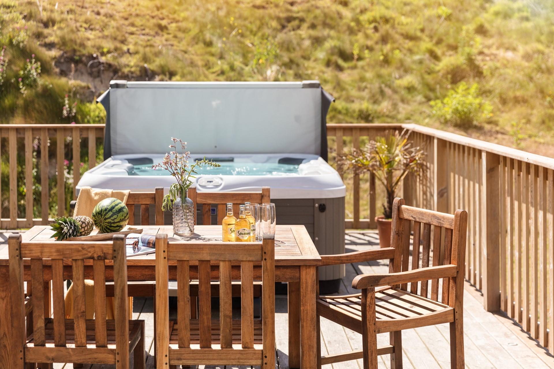 Dip into the hot tub after enjoying a cold sundowner.