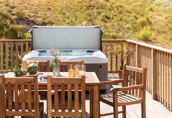 Dip into the hot tub after enjoying a cold sundowner.