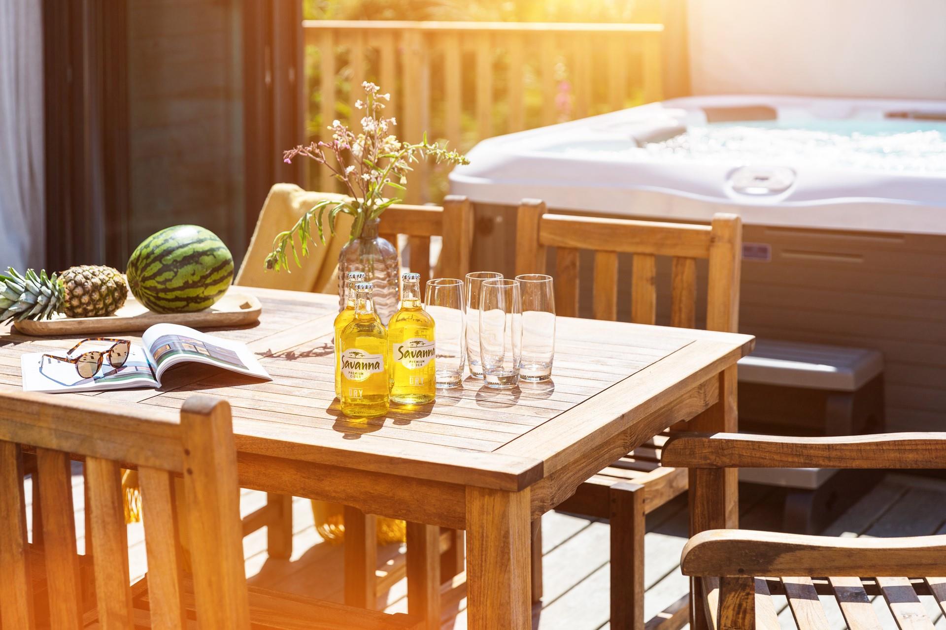 After enjoying a dip in your hot tub, come out for a lazy lunch on the decking.