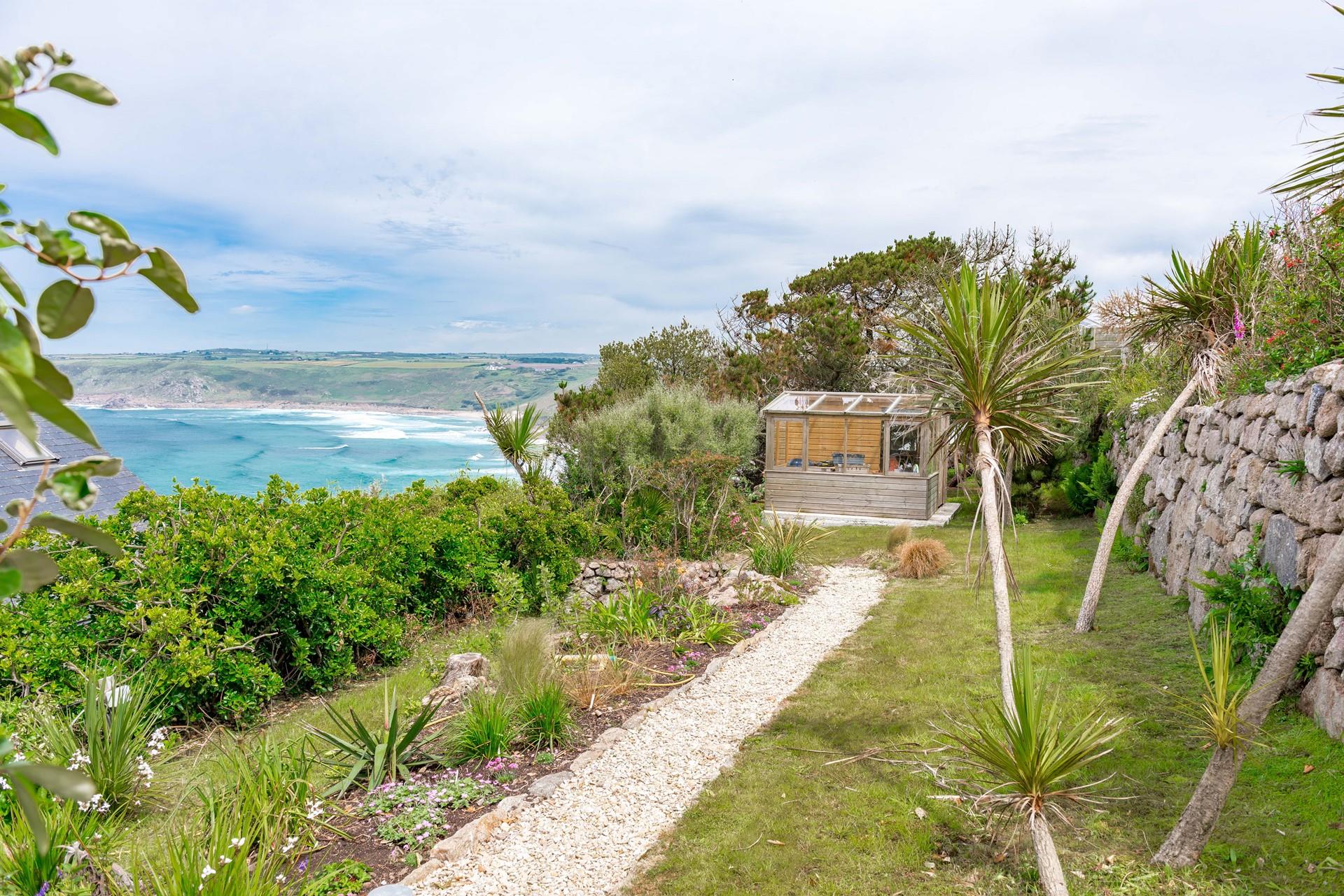 Admire the view from the lovely terraced garden, taking in the sea air.