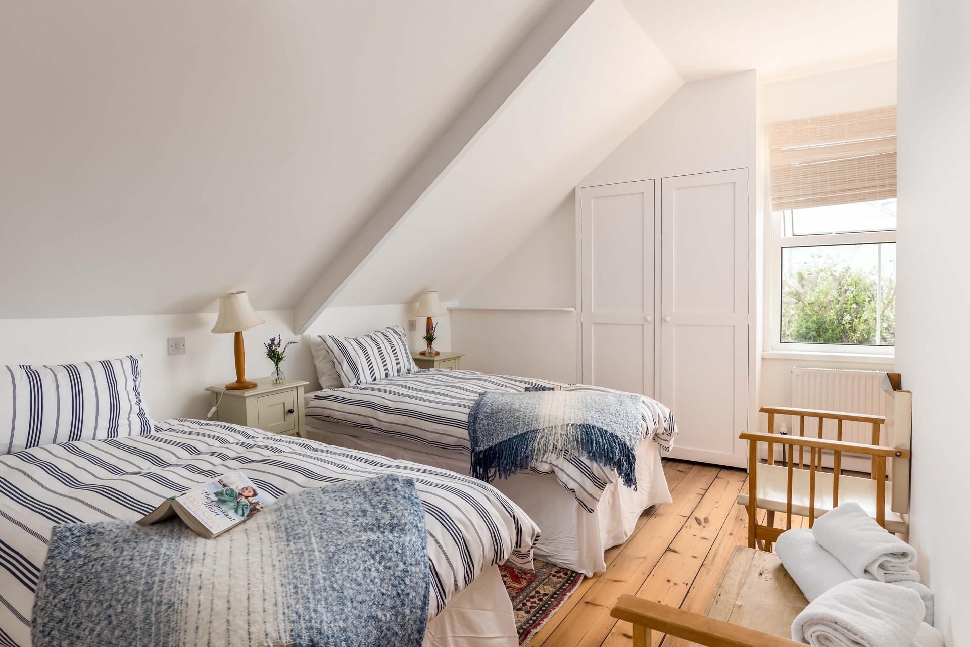 The first floor twin bedroom has a cosy, nautical feel.