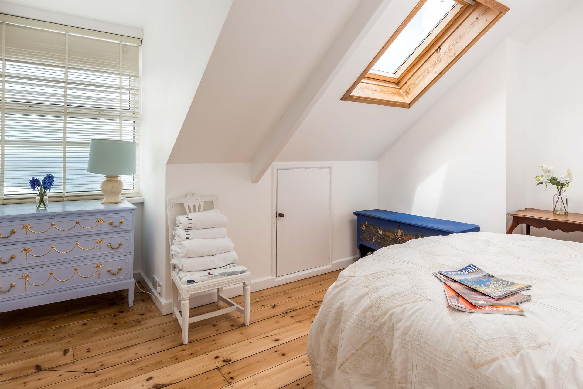 The double bedroom is full of hand-painted furniture and provides a relaxing space to rest at night.
