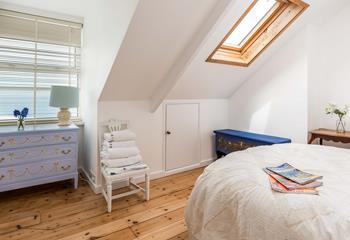 The double bedroom is full of hand-painted furniture and provides a relaxing space to rest at night.