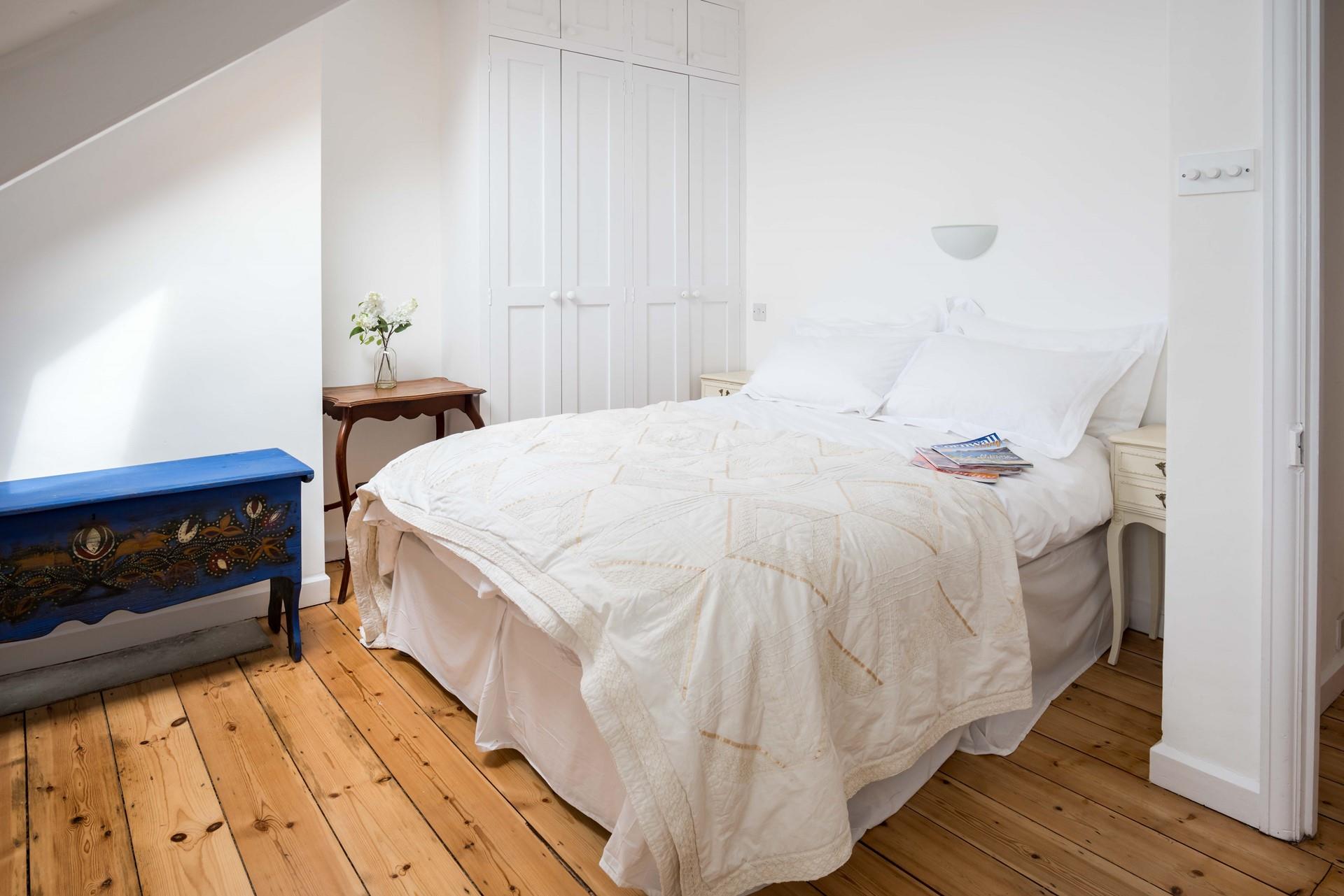 Tuck into the double bed after a day of walking the South West Coast Path.