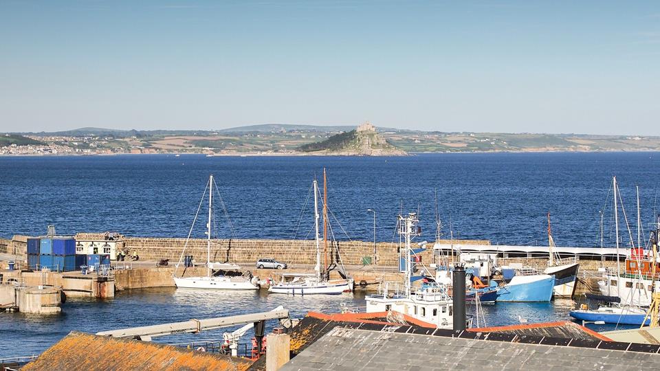 Sit back and take in the view over Penzance harbour and St Michael's Mount from the dining table.