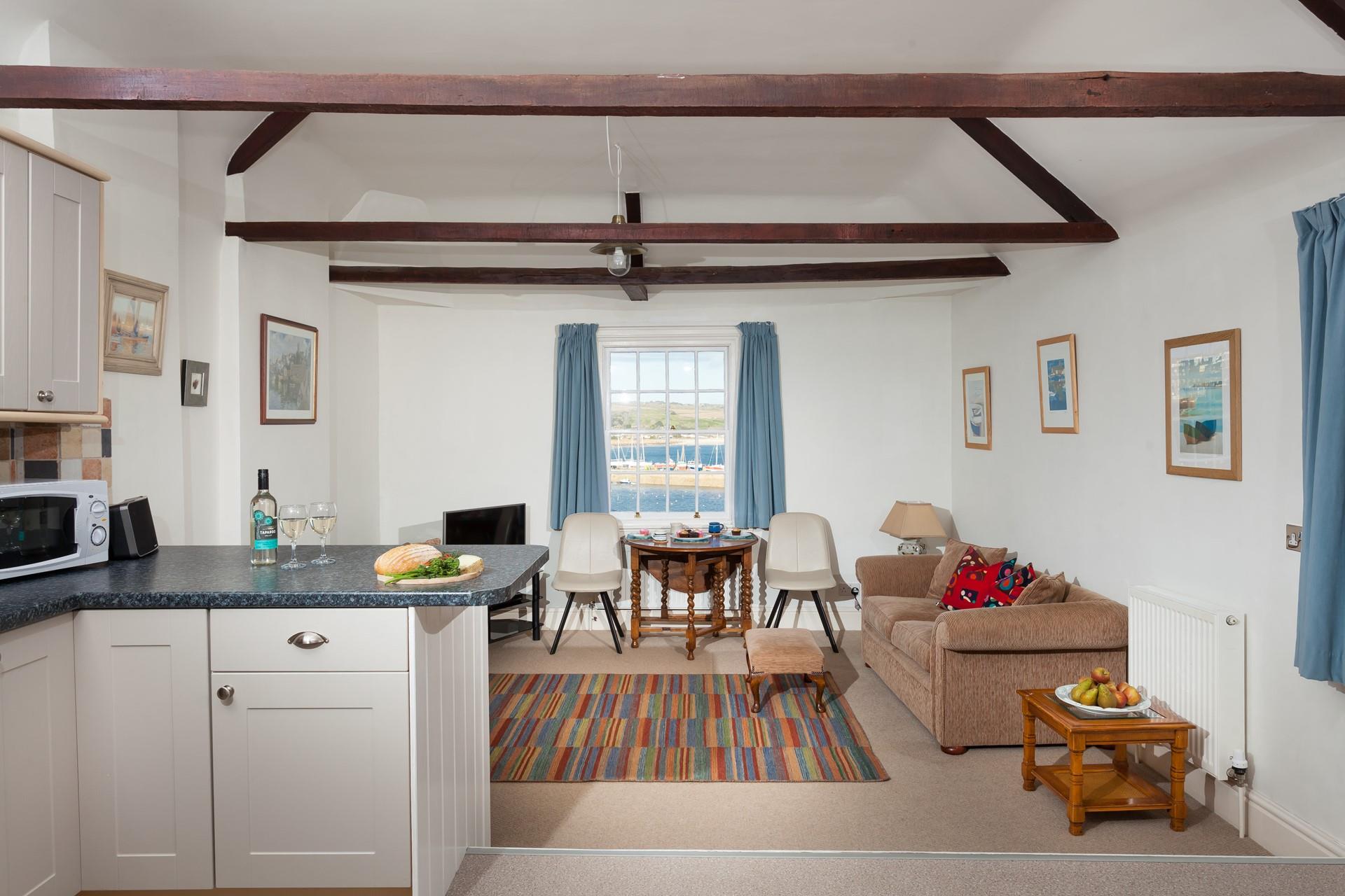 The light and bright open plan living area provides you with the perfect space to cook and relax.