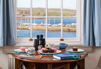 Enjoy a Cornish cream tea overlooking the bobbing boats in the harbour.