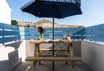 The secluded patio area offers a romantic spot to dine al fresco and catch the last of the day's sun.