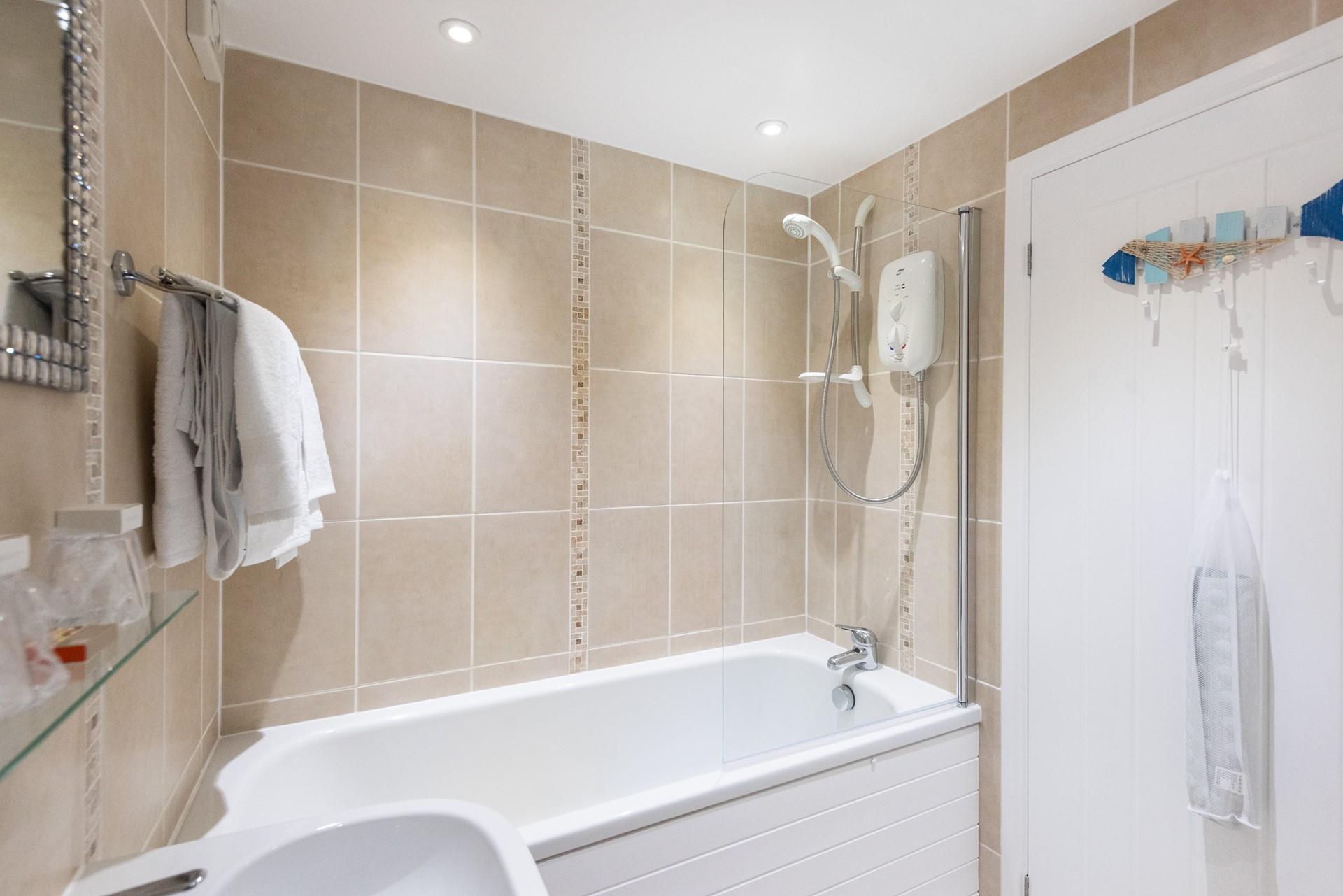 Enjoy a soothing soak after a day exploring coastal paths.