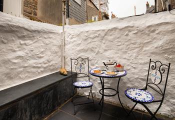 The enclosed courtyard area is perfect for a morning cuppa or afternoon tea.