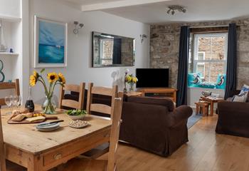 The sitting room has traditional features such as the lovely granite wall.