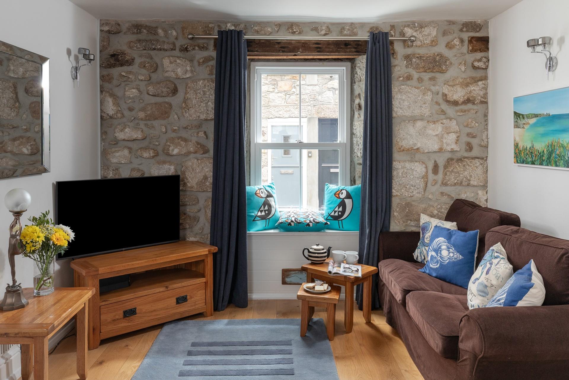 Come back from a day on the beach to unwind in the comfortable sitting room.