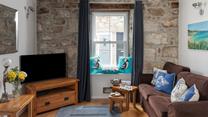 Come back from a day on the beach to unwind in the comfortable sitting room.