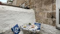 The enclosed courtyard area is perfect for a morning cuppa or afternoon tea.