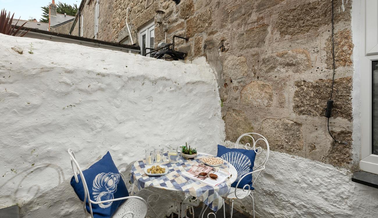 The enclosed courtyard area is perfect for a morning cuppa or afternoon tea.