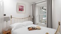 The spacious king size bed offers a peaceful night's sleep.