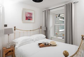 The spacious king size bed offers a peaceful night's sleep.