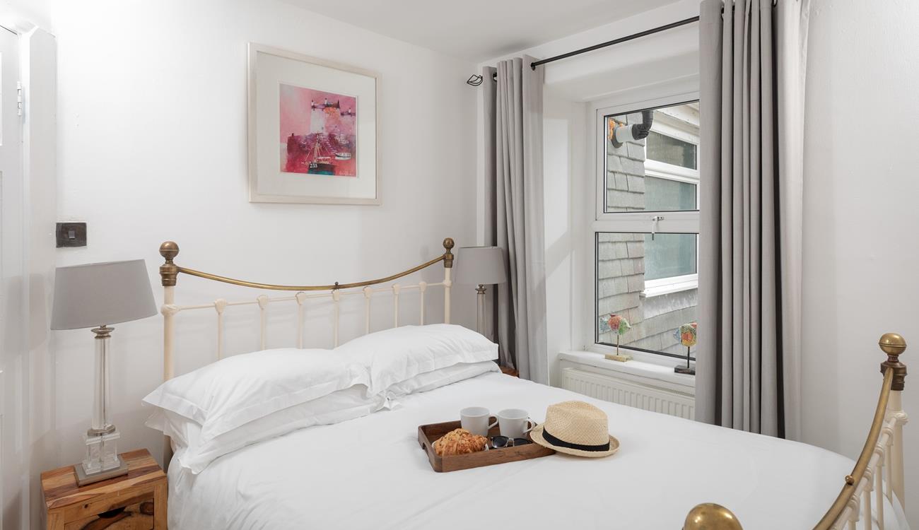 The spacious king size bed offers a peaceful night's sleep.