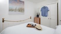 The bedrooms are decorated with calming tones.
