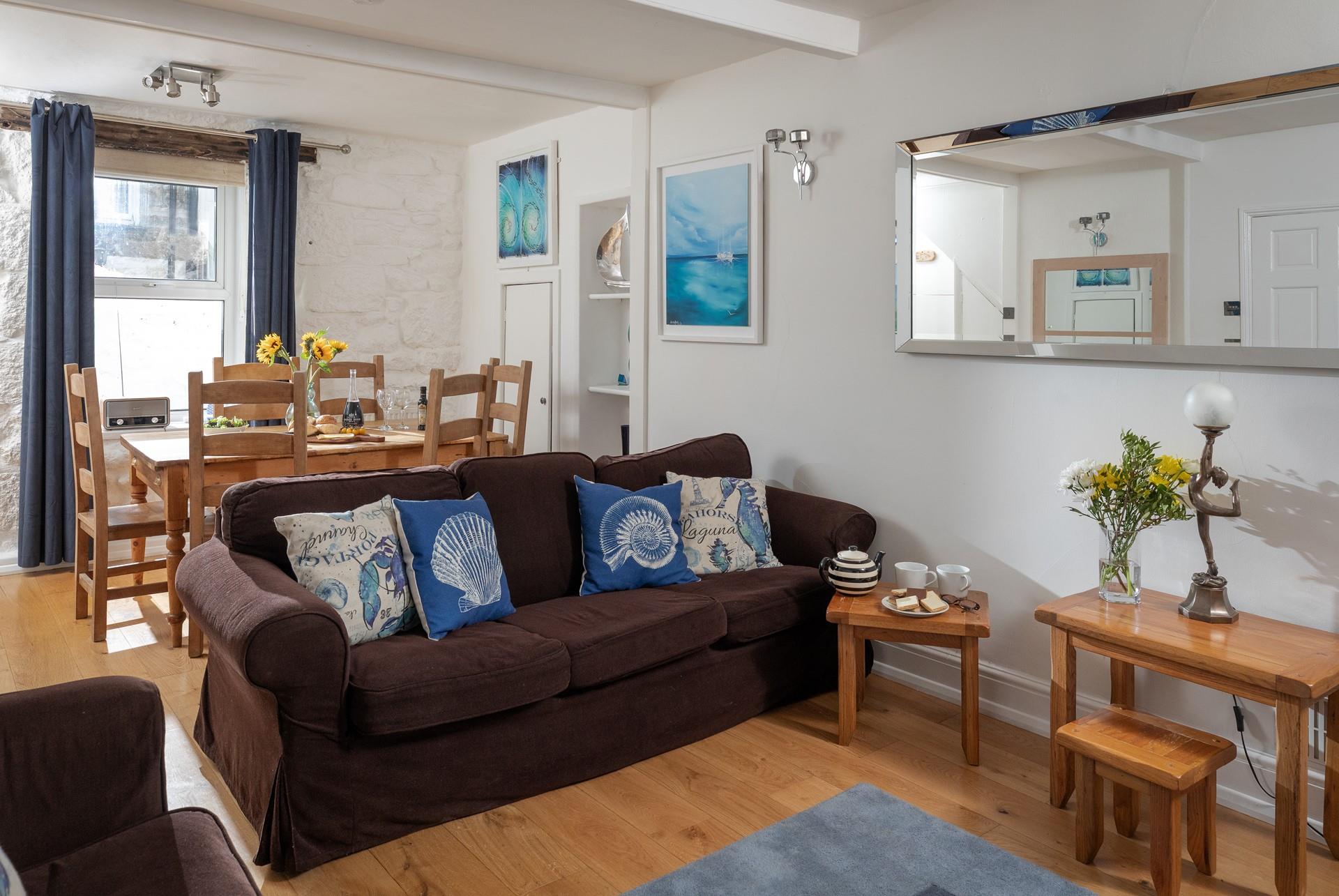 The cosy sitting room provides a relaxing retreat to return to.