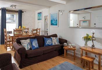 The cosy sitting room provides a relaxing retreat to return to.