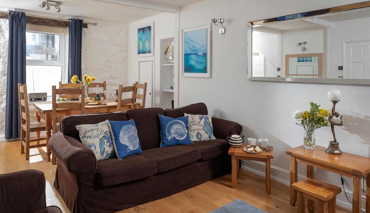 The cosy sitting room provides a relaxing retreat to return to.