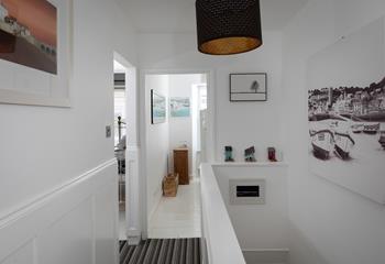 The artwork on the walls features scenes of St Ives.