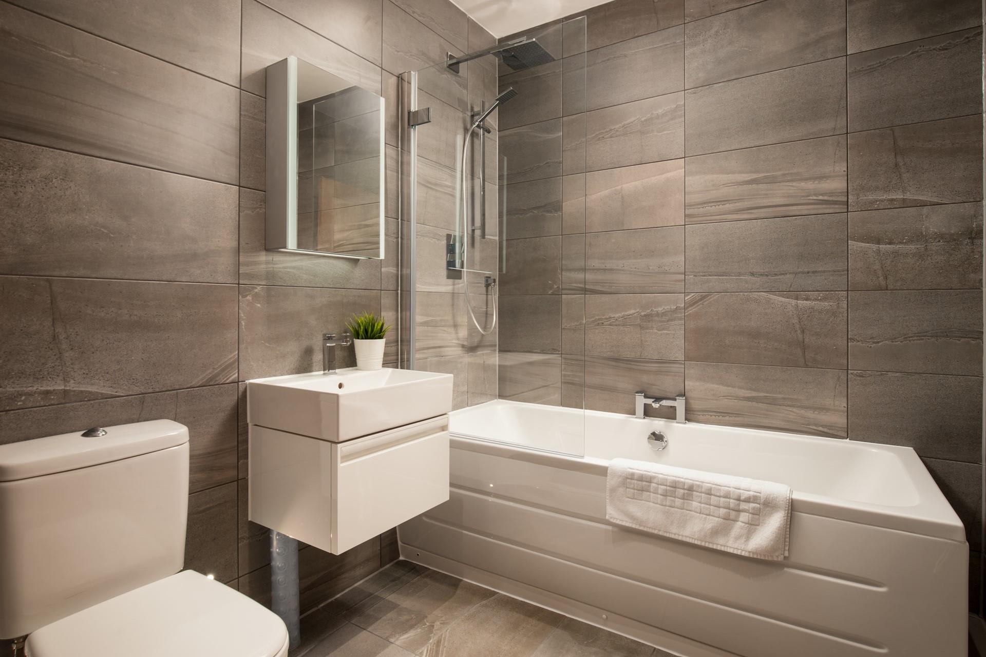 The family bathroom has a fabulous bath, perfect for soaking in after a day on the beach.