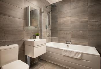 The family bathroom has a fabulous bath, perfect for soaking in after a day on the beach.