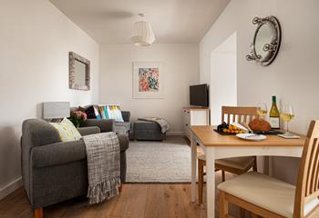 Compact yet cosy, the lovely open plan living space is filled with soft tones and classic furniture, creating a real home from home feel.