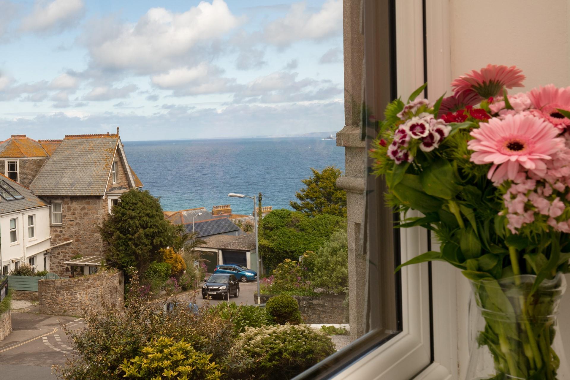 Sip on your first hot drink of the day whilst watching the sun glitter on the sea.